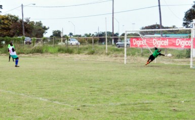  A Carmel Secondary School player scores from the penalty spot.