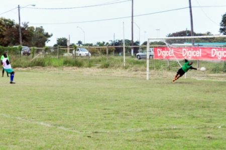  A Carmel Secondary School player scores from the penalty spot.