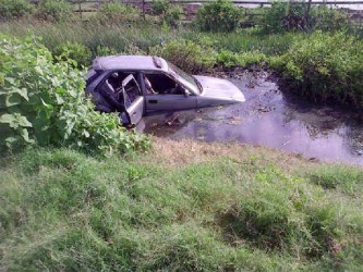 The car in a trench after the accident 