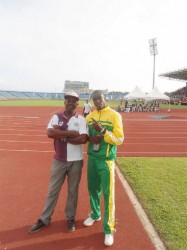 Leslain Baird (right) stands alongside his coach Robert Chisholm at the Hasely Crawford Stadium in Trinidad and Tobago.  
