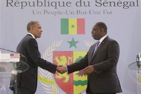 U.S. President Barack Obama (L) and Senegal President Macky Sall shake hands after their joint news conference at the Presidential Palace June 27, 2013 in Dakar, Sengal. Obama’s trip, his second to the continent as president, will take him to Senegal, South Africa and Tanzania. REUTERS/Gary Cameron
