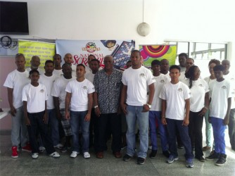 The players along with the President of Guyana Association of Scrabble Players (GASP) Leon Belony, Administrative Officer of the NSC Gervy C. Harry, Courts Marketing Manager Pernell Cummings after the opening ceremony yesterday morning at Bank of Guyana. 