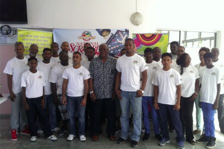 The players along with the President of Guyana Association of Scrabble Players (GASP) Leon Belony, Administrative Officer of the NSC Gervy C. Harry, Courts Marketing Manager Pernell Cummings after the opening ceremony yesterday morning at Bank of Guyana.