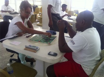 Robert Williams (right) and Abigail McDonald in the first round of the National Scrabble Championship yesterday morning.