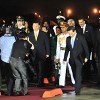 Chinese President Xi Jinping, left, and Prime Minister Kamla Persad-Bissessar are followed by Foreign Affairs Minister WInston Dookeran and President Anthony Carmona, circled, at South Terminal, Piarco International Airport, on Friday night after the arrival of the Chinese leader on a State visit.