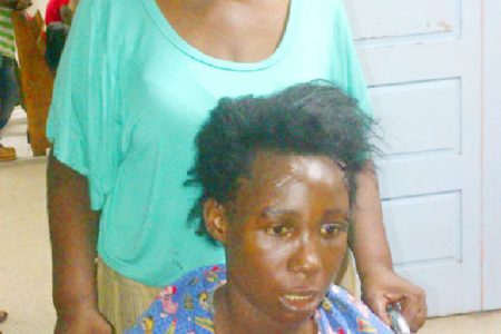Irene Barry wheels her visibly shaken daughter out of the Accident and Emergency Unit of the Georgetown Public Hospital 