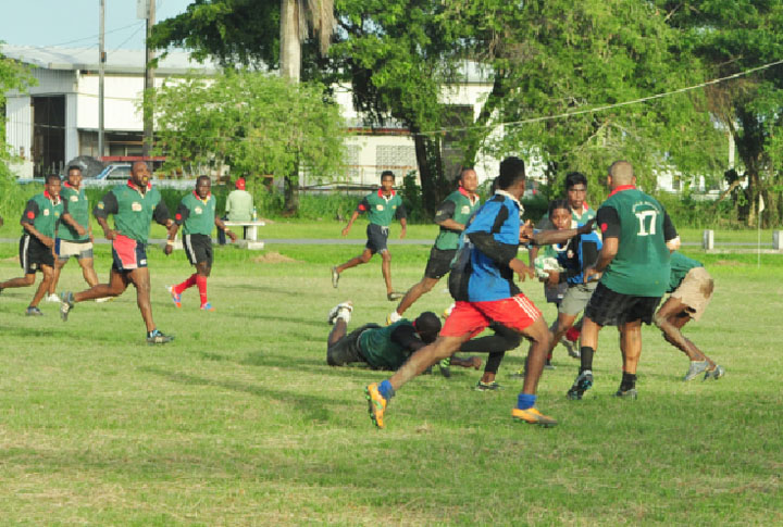 The National under-19 ruggers going against the rest team made up of national senior players  during yesterday’s final simulation game at the National Park rugby field. (Orlando Charles photo) 