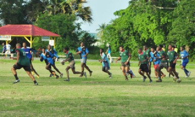 National Under-19 rugby captain Godfrey Broomes (with ball) in action during a recent simulation game at the National Park Rugby field.  