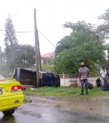 The vehicle that was transporting the inmates after it came to a rest in the canal at Supply, East Bank Demerara after the accident. 