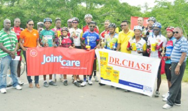 Winners and runners-up of the 4th annual Seven Seas Multivitamins and Dr. Chase Nerve Foods 50-mile road race pose with their spoils upon completion of yesterday’s event. (Orlando Charles photo)