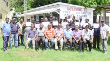 Assistant Superintendent of Police, Jairam Ramlakhan (seated, centre) poses with other officers and members of the CPGs and SMC    