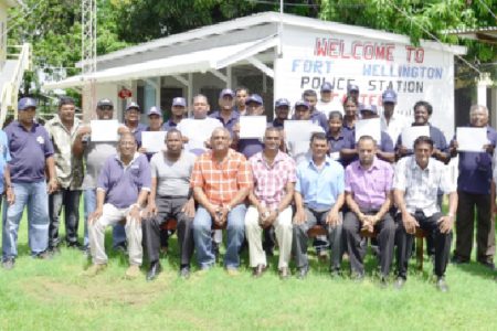 Assistant Superintendent of Police, Jairam Ramlakhan (seated, centre) poses with other officers and members of the CPGs and SMC
 
