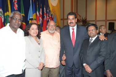 A meeting with Maduro: Guyana’s President Donald Ramotar (centre) with Venezuelan President Nicolas Maduro (second from right)  and Ministers of Finance, Dr Ashni Singh (right); Public Works, Robeson Benn (left) and Foreign Affairs Carolyn Rodrigues- Birkett at the 34th Caricom Heads of Government Conference in Trinidad. (GINA photo)