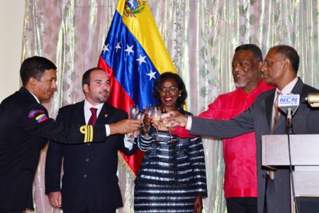 Toast to Venezuela: Prime Minister Samuel Hinds (second from right), Venezuelan Ambassador to Guyana, Reina Arratia Diaz (centre), Minister of Agriculture and Minister of Foreign Affairs (acting), Dr. Leslie Ramsammy (right) and members of the diplomatic corps during a toast to commemorate Venezuela’s Independence Day on Friday at the Impeccable Banquet Hall, Brickdam. (GINA photo)