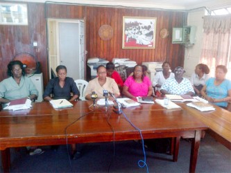 GPSU’s acting President Deborah Murphy (centre), flanked by the union’s 2nd VP Dawn Gardener (second from left) and 3rd VP Carmelita Laulys (third from right, front) at a news conference yesterday 