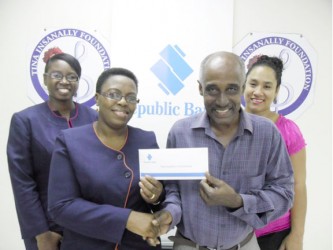 In photo, Erica Jeffrey (left), Manager – Branch Support Services of Republic Bank is seen handing over the cheque to cover the entire cost for the workshop to steel-pan maker and tuner, Aubrey Bryan while Maria Leung (right in background) of the Tina Insanally Foundation and Jonelle Dummett of Republic Bank look on.     
