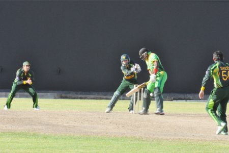 Christopher Barnwell plays a Saeed Ajmal delivery with focus.