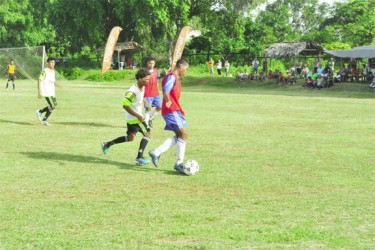 Santa Rosa Secondary and Hosororo Secondary battling for possession in the Digicel Schools Football tourney at the Mabaruma Community Centre ground
