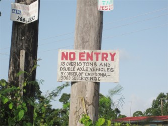 After receiving dozens of complaints, the NDC nailed this sign at the entrance to the road - a few feet from the decayed bridge. Residents said that the NDC does not enforce the restrictions. 