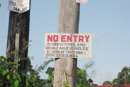 After receiving dozens of complaints, the NDC nailed this sign at the entrance to the road - a few feet from the decayed bridge. Residents said that the NDC does not enforce the restrictions.

