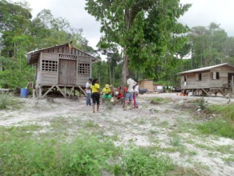 GWMO President Simona Broomes and others in discussion with some residents of the 14 Miles backdam