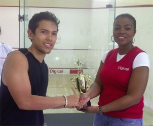 Men’s Champion, Alex Arjoon receives his first place prize from Digicel’s Junior Marketing Manager Tandika Johnson (right) at the Georgetown Club yesterday afternoon. 