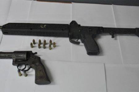 Police said both the Kel-Tec 9mm sub-machine gun with nine rounds and the .38 revolver with two rounds pictured here were recovered from the two men. (Guyana Police Force photo)