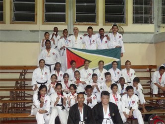 The triumphant team sitting with Master Frank Woon-a-Tai (front right) at the end of the tournament.