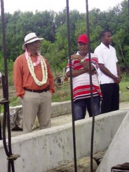 Prime Minister Samuel Hinds (left) at the Mahaicony koker with Chairman of Region Five Bindrabhan Bisnauth (centre)  (GINA photo)