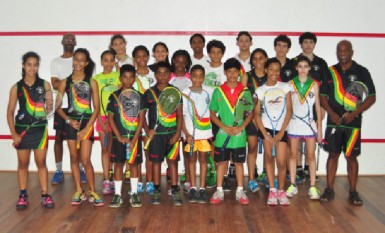 Coach Carl Ince (right) and members of the Guyana Squash Team that will be participating at the Caribbean Area Squash Association (CASA) Championships in Trinidad and Tobago 