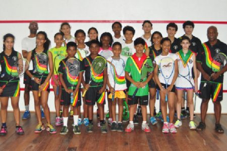 Coach Carl Ince (right) and members of the Guyana Squash Team that will be participating at the Caribbean Area Squash Association (CASA) Championships in Trinidad and Tobago