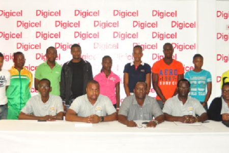 Sitting from left are Boyce and Jefford Classic Technical Delegate, Cornell Rose, Co-Chariman Edison Jefford, Digicel’s Sponsorship and Events Manager, Gavin Hooper, Co-Chairman Colin Boyce and Shanomae Blackmore, Secretary. Standing behind are local club athletes. (Photo by Orlando Charles)
