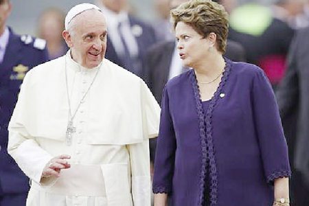 Pope Francis is greeted by Brazilian President Dilma Rousseff as he arrived in Brazil yesterday