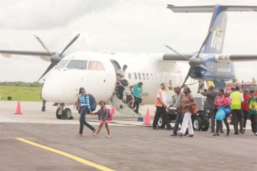 Passengers disembarking the LIAT flight yesterday afternoon 