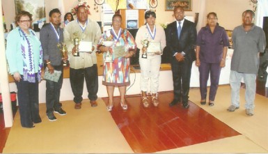 Winners of the inaugural Gregory Gaskin Memorial/Berbice Sports Award ceremony posing with their awards.
