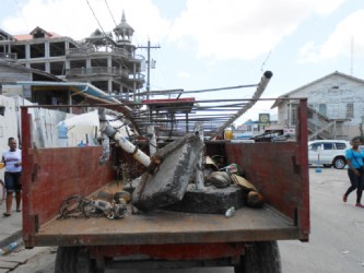 The Town Council’s tractor-trailer with items removed from the road shoulders and pavements