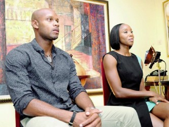 Olympians Asafa Powell and Sherone Simpson prior to the interview at the New Kingston offices of Samuda and Johnson. 