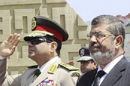Egypt’sChief of Staff Abdel Fattah al-Sisi (L) and Egyptian President Mohamed Morsi in April, 2013. Photo: Reuters
