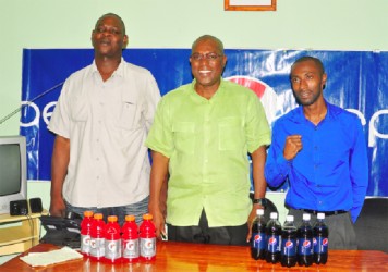 GBA’s Technical Director and President, Terrence Poole (left) and Steve Ninvalle (centre) pose for a photo opportunity with DDL’s Brand Executive for Gatorade and Pepsi, Larry Wills following yesterday’s press briefing at the Ministry of Sport. (Orlando Charles photo)