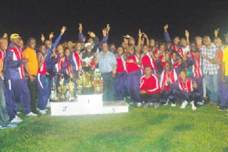 Headquarters athletes celebrate after retaining their title in the Police annual track and field championship last Friday evening at the Police Sports Club ground, Eve Leary.