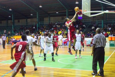  Action in the YBG/Partners in Christ All-Star basketball night U20 matchup between Guyana and USA.