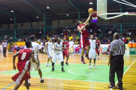  Action in the YBG/Partners in Christ All-Star basketball night U20 matchup between Guyana and USA.