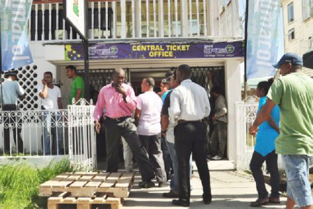 Some of the eager cricket fans awaiting their turn to purchase tickets yesterday.
