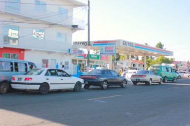 Motorists lining up at the GuyOil Gas Station on Sheriff Street to purchase gasoline. 