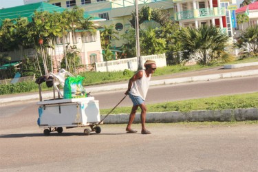 A vendor as he pulls his cart from the location.  