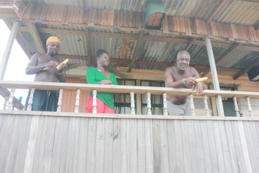 Victoria residents Winston Armstrong and his wife Carlotta along with Julian Trotman on their verandah (Arian Browne photo)