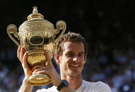 Andy Murray of Britain holds the winners trophy after defeating Novak Djokovic of Serbia in their men's singles final tennis match at the Wimbledon Tennis Championships, in London July 7, 2013.
REUTERS/Stefan Wermuth
