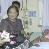 Nicolette Allen, one of the hospitalized, being visited by Prime Minister of Trinidad & Tobago Kamla Persad-Bissessar and Health Minister Dr Leslie Ramsammy. (Stabroek News file photo)