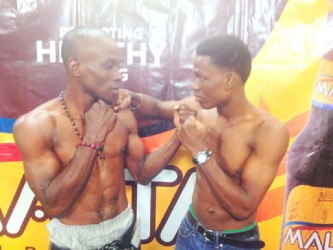 Calm before the storm! Anson Green (left) and Clive ‘The Punisher’ Atwell square off for a photo opportunity at yesterday’s press briefing ahead of tonight’s lightweight main event match up. 