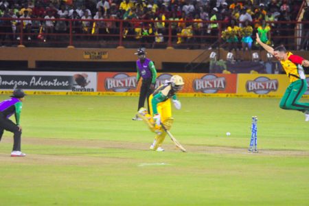 KEY WICKET! An airborne James Franklin appeals as danger man Chris Gayle is found short of the crease. (Orlando Charles photo)
